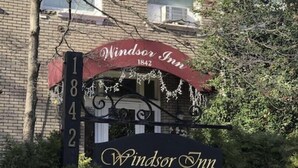 A Windsor Inn Hotel sign with a vintage design, including the year 1842. - Windsor Inn Hotel (Washington)