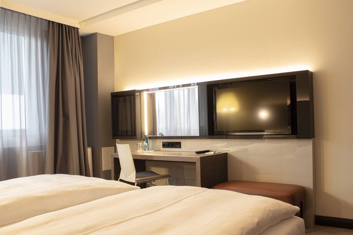 Standard Double or Twin Room | Living area | LCD TV, pay movies