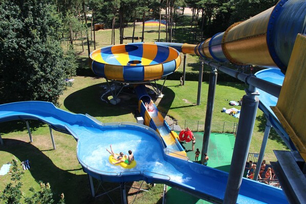 A water park with multiple slides and a large water slide structure.