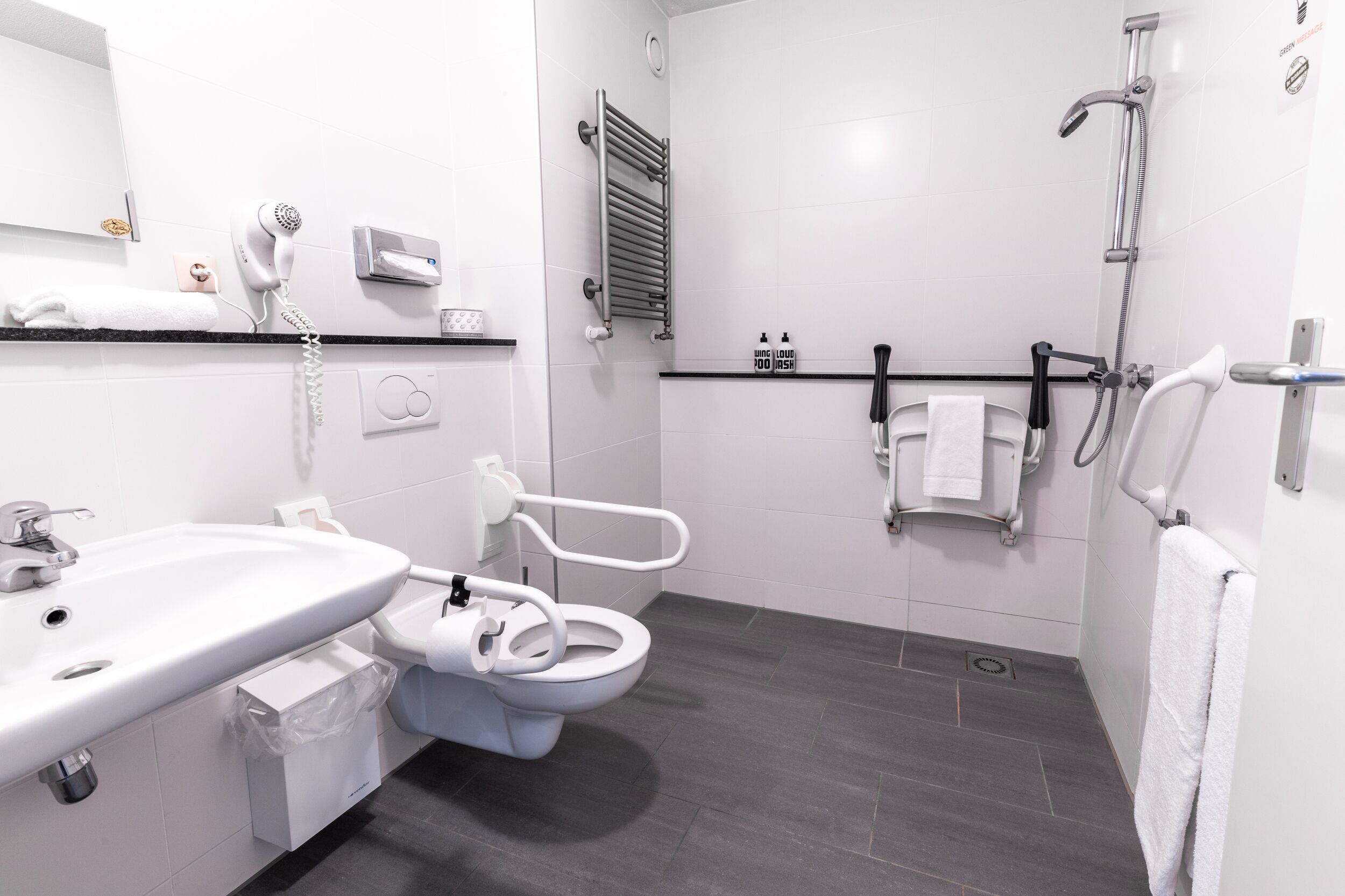 double room for disabled guests | bathroom | combined shower/bathtub, eco-friendly toiletries, hair dryer, towels