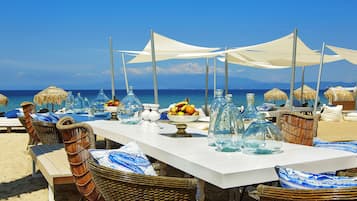 On the beach, sun-loungers, beach umbrellas, beach towels