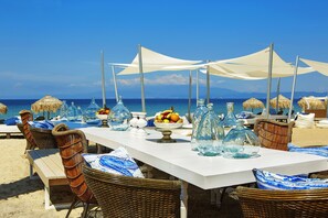 On the beach, sun loungers, beach umbrellas, beach towels