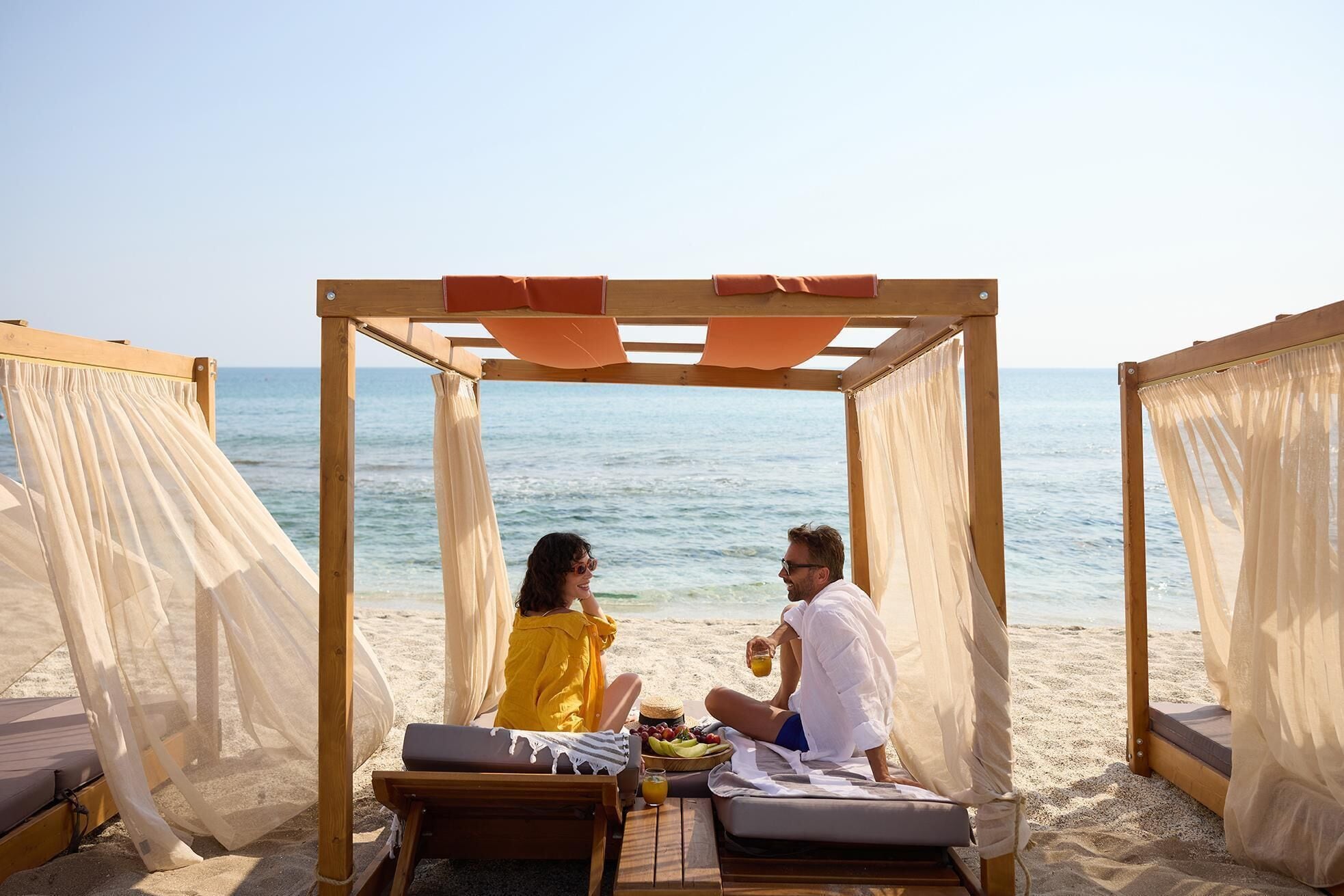 On the beach, sun-loungers, beach umbrellas, beach towels