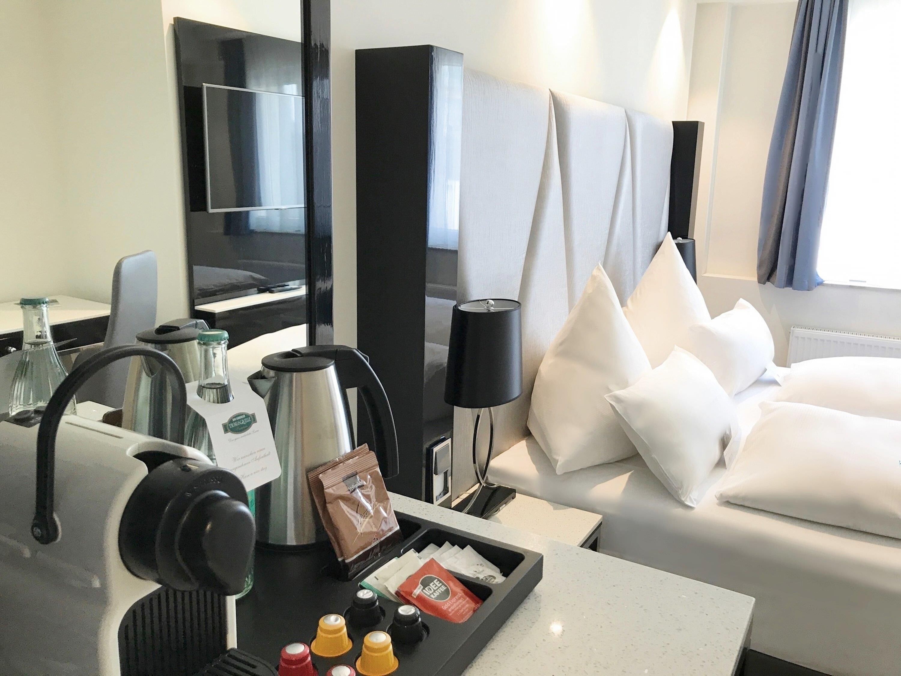 Premium bedding, down comforters, minibar, in-room safe