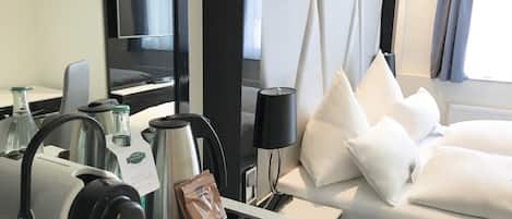 Premium bedding, down comforters, minibar, in-room safe