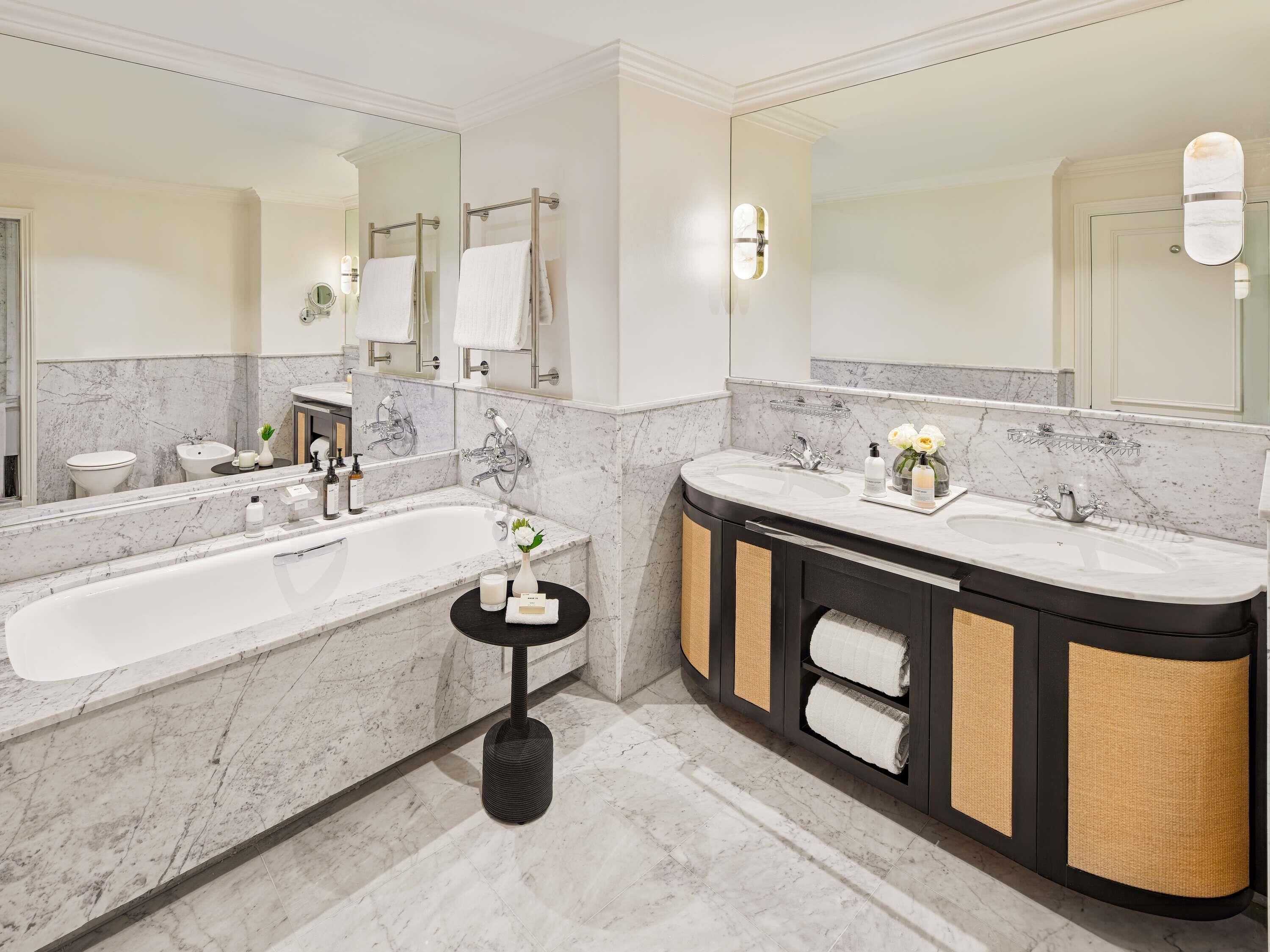 Separate bathtub and shower, deep-soaking bathtub, designer toiletries
