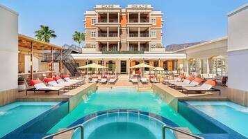 Outdoor pool, pool umbrellas, sun loungers