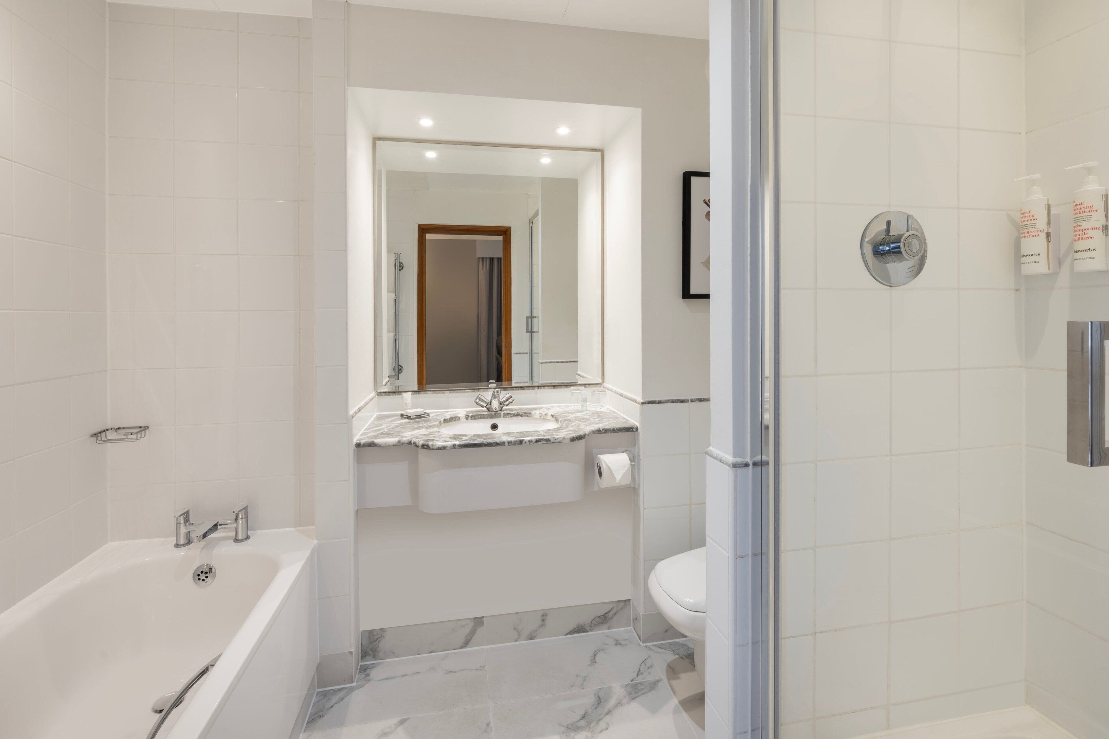 suite, 1 bedroom, non smoking | bathroom | combined shower/bathtub, designer toiletries, hair dryer, towels