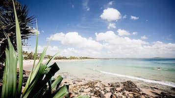 Beach nearby, white sand, beach towels