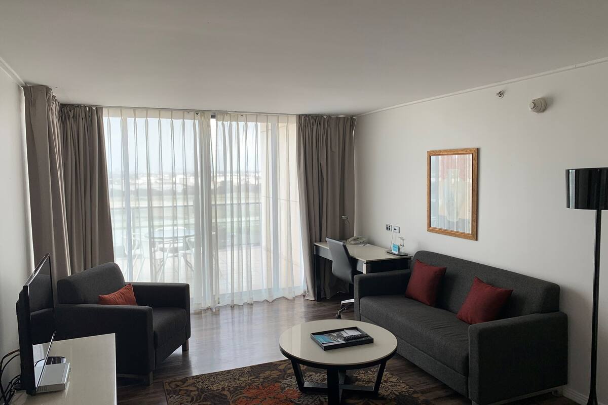 one bedroom apartment | living room | 32-inch lcd tv with digital channels, tv