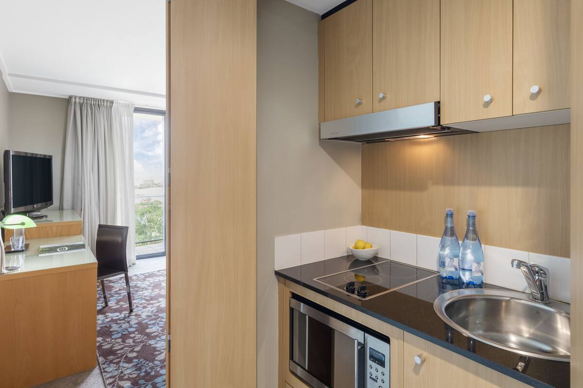executive studio with balcony | private kitchenette | fridge, microwave, stovetop, dishwasher