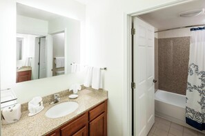 Hair dryer, towels, shampoo, toilet paper