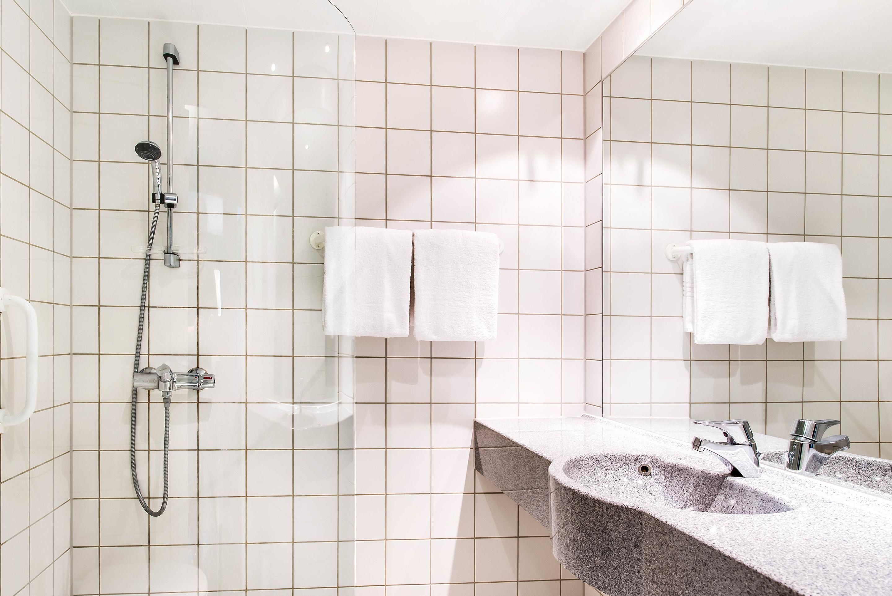 shower, free toiletries, hair dryer, towels