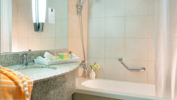 Bathtub, hair dryer, towels