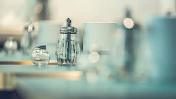 A modern, well-lit room with a clear glass jar and a matching container on a reflective surface, suggesting a clean and contemporary design.