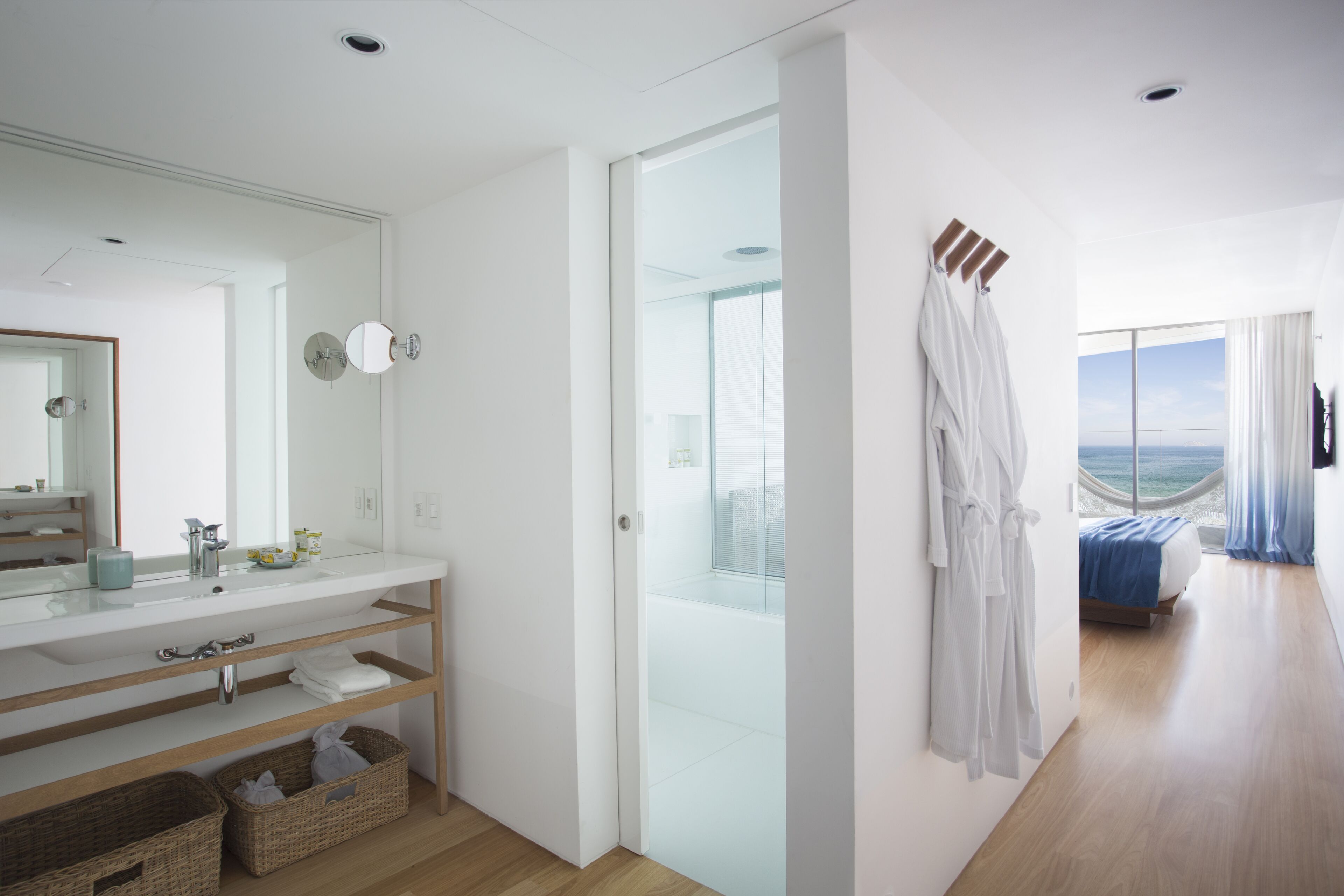 grand room, balcony, ocean view | bathroom | shower, designer toiletries, hair dryer, bathrobes