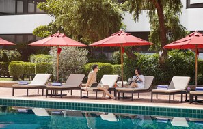 Outdoor pool, pool umbrellas, sun loungers
