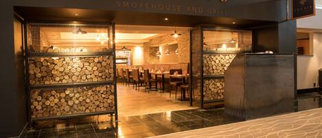 A restaurant entrance with a sign reading "THERIB Smokehouse and Grill".