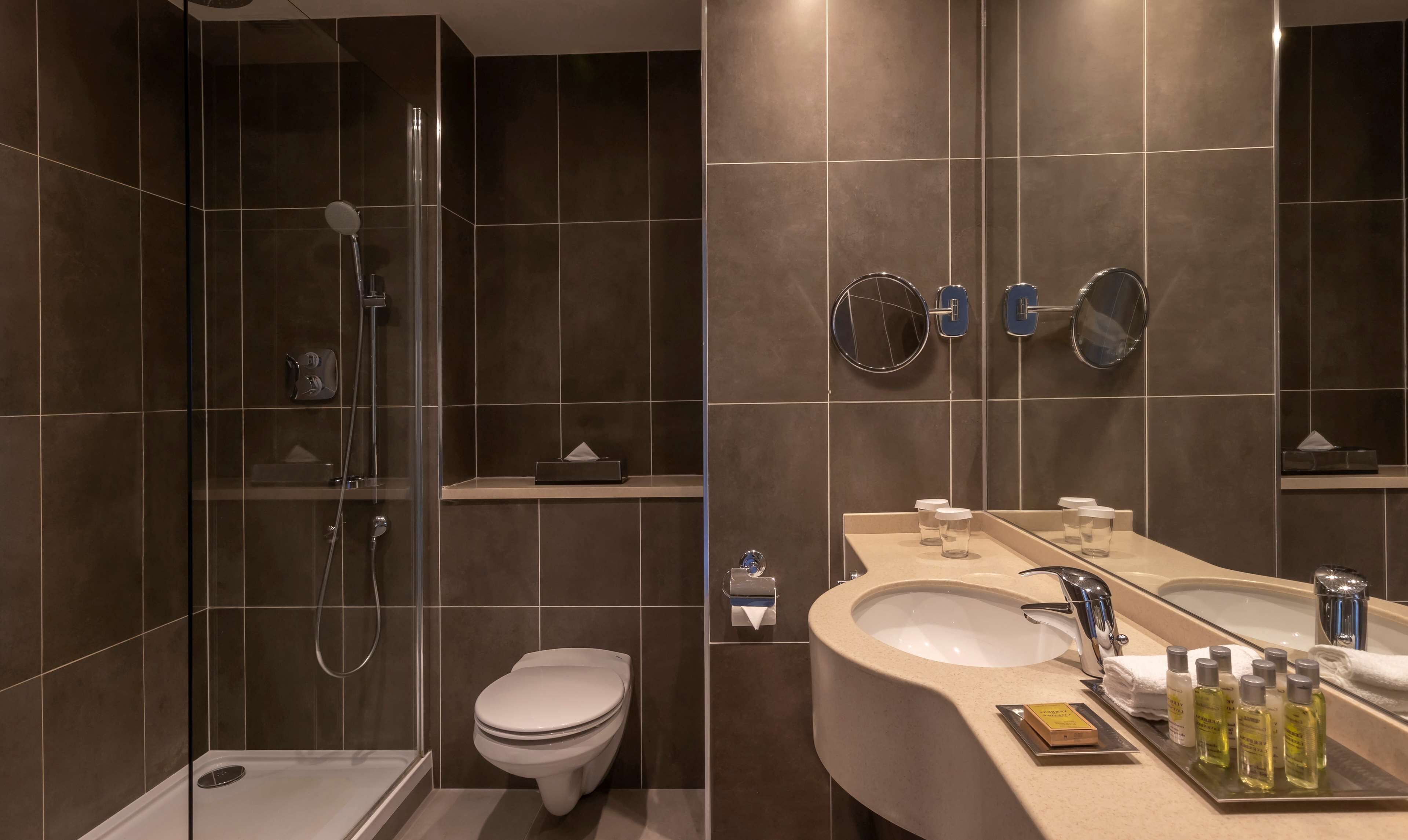 deep-soaking bathtub, rainfall showerhead, free toiletries, hair dryer