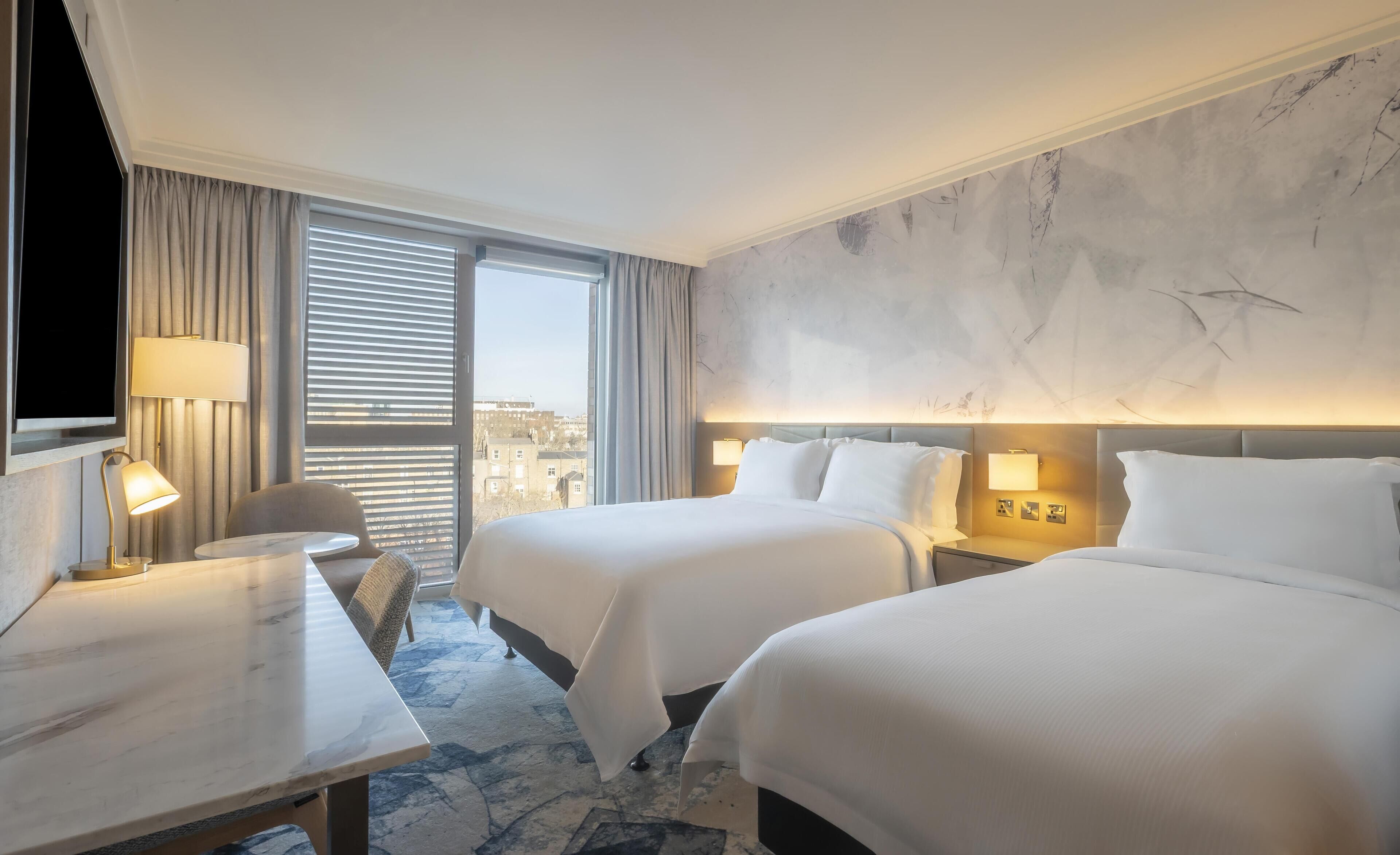 Deluxe Triple Room, 2 Twin Beds | In-room safe, desk, laptop workspace, blackout drapes