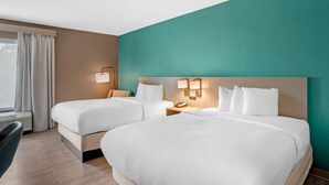 A hotel room with two beds, a desk, and a window with curtains. - Comfort Inn & Suites Mt. Holly - Westampton (Mount Holly)