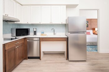 Full-size fridge, microwave, stovetop, dishwasher at Compass by Margaritaville Hotel Naples