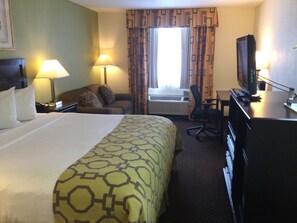 Premium bedding, desk, laptop workspace, blackout curtains