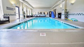 An indoor swimming pool with a no lifeguard on duty sign, a no diving sign, and a no diving sign. - Fairfield Inn & Suites by Marriott Grand Junction Downtown (Grand Junction)