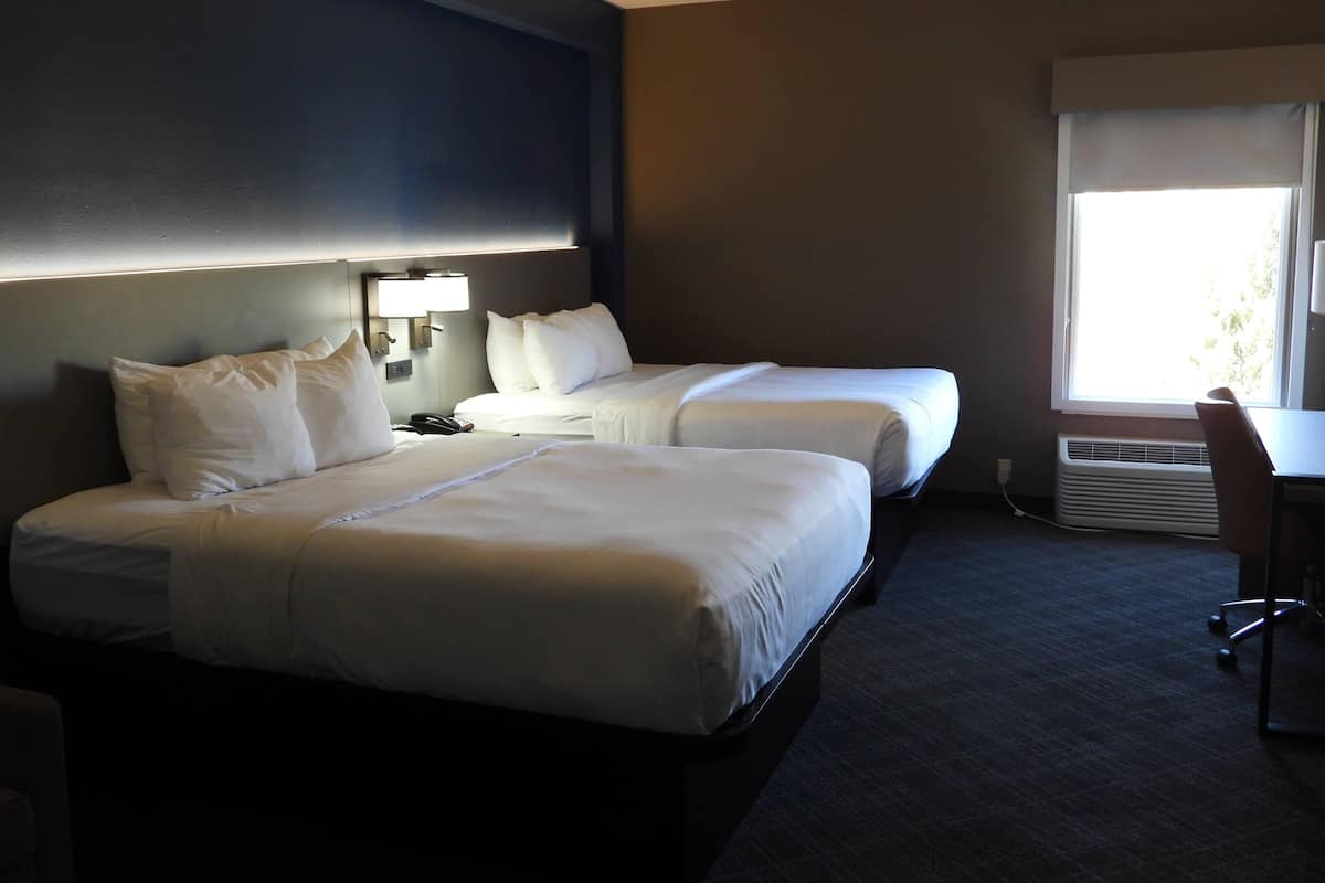 Suite, 2 Queen Beds, Non Smoking | Desk, laptop workspace, blackout drapes, soundproofing