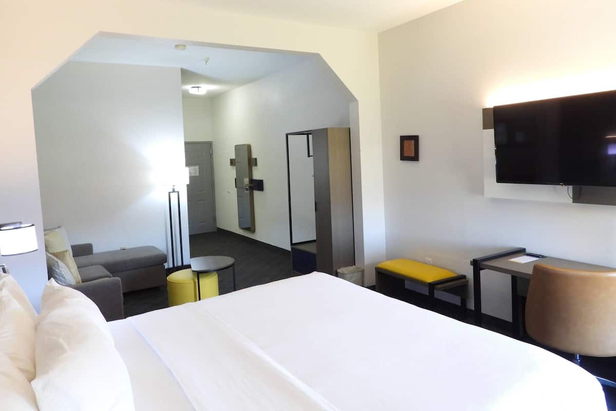 Suite, 1 King Bed with Sofa bed, Non Smoking | Desk, laptop workspace, blackout curtains, soundproofing