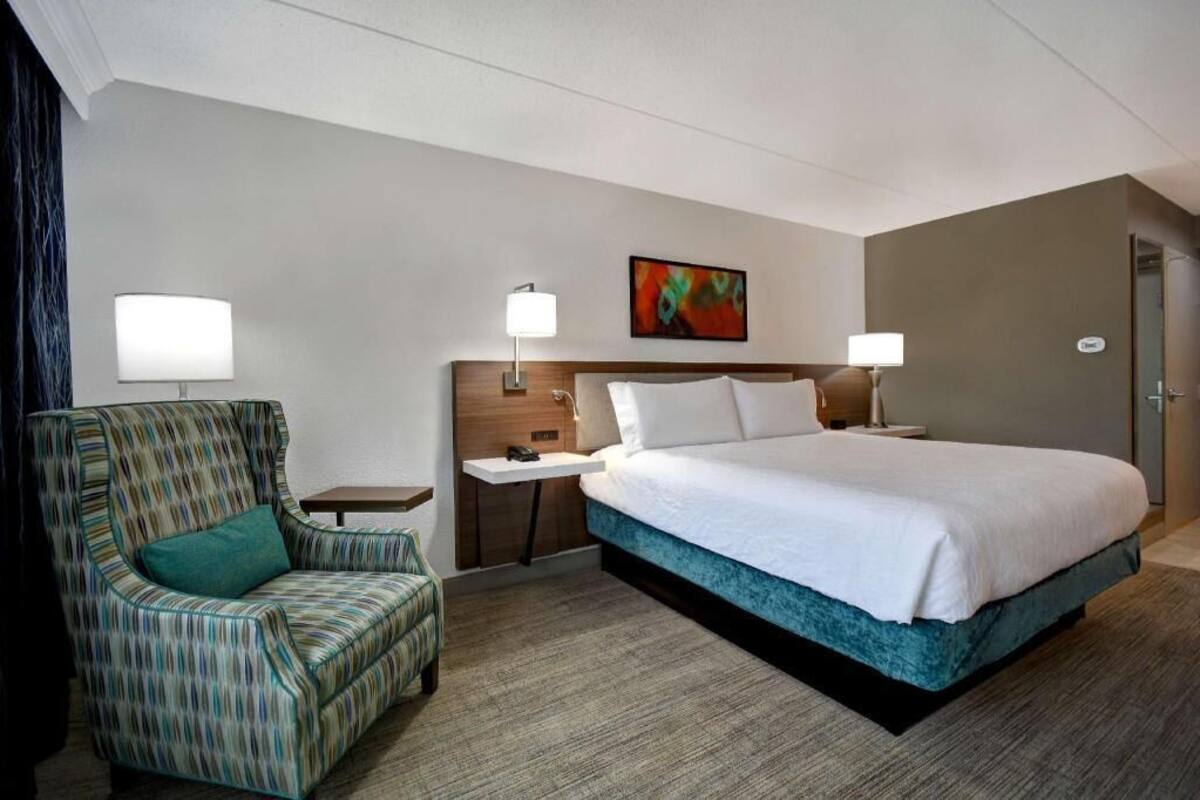 Desk, laptop workspace, blackout drapes, iron/ironing board