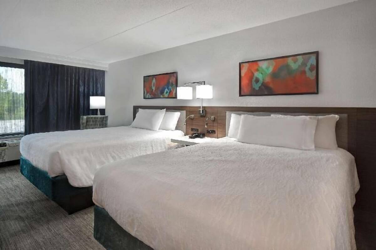 Desk, laptop workspace, blackout drapes, iron/ironing board