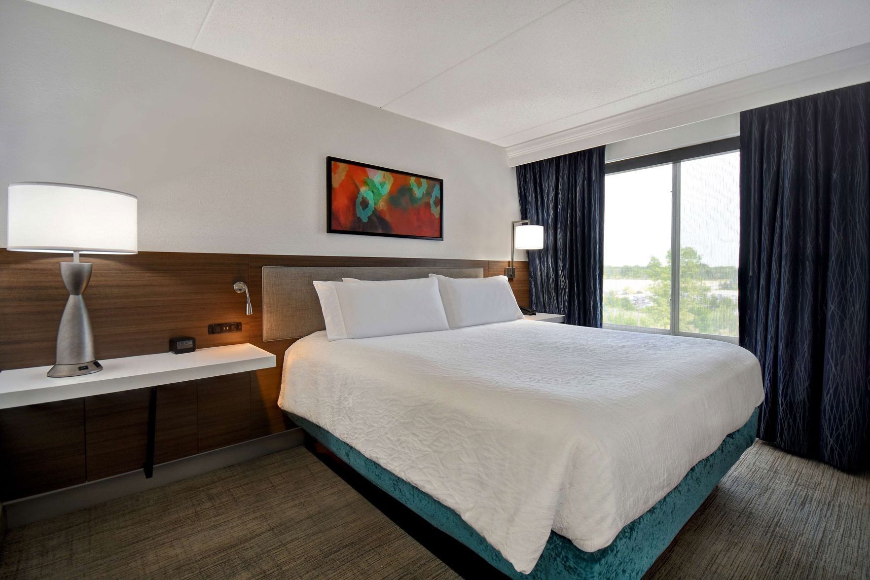 Desk, laptop workspace, blackout drapes, iron/ironing board