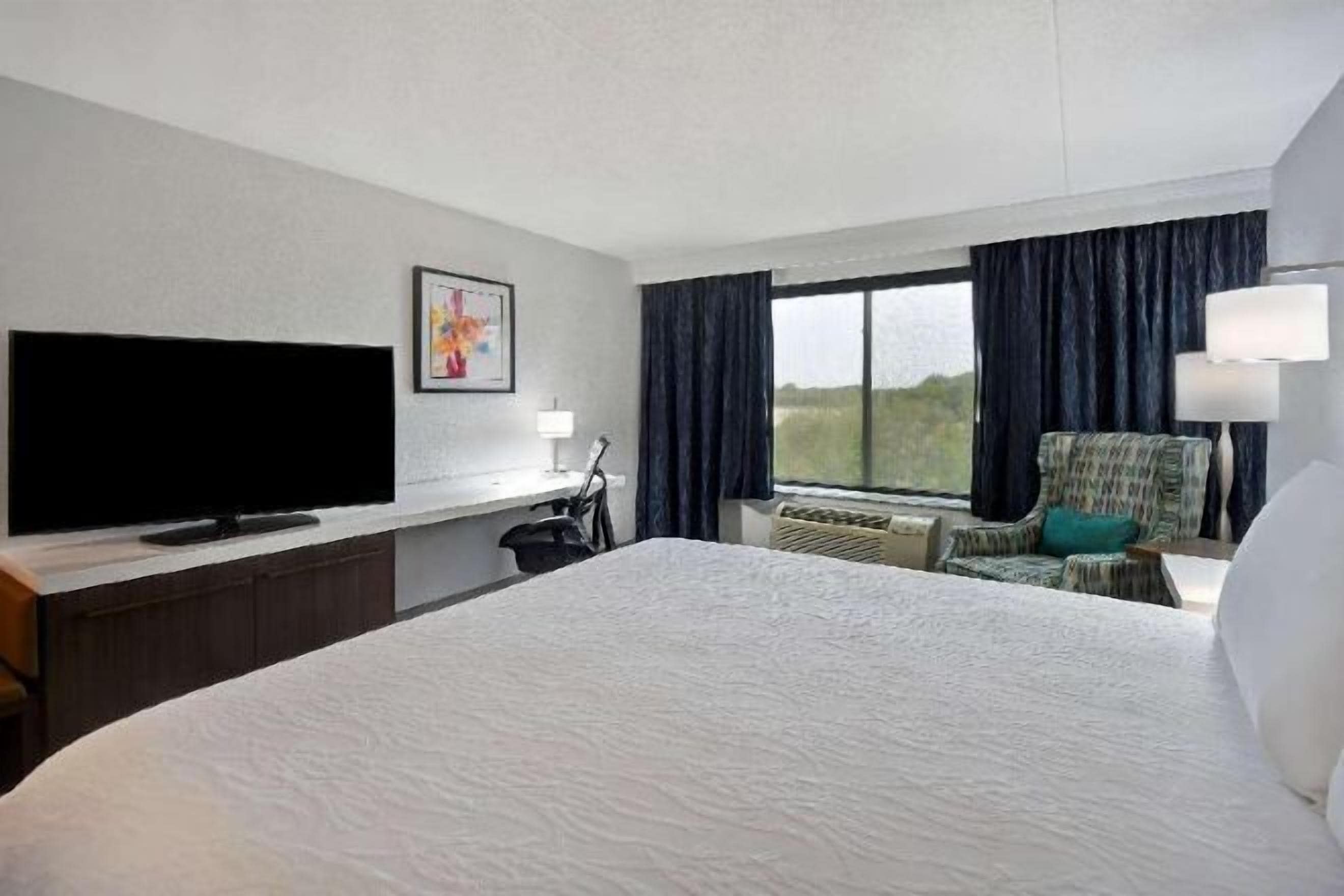 Desk, laptop workspace, blackout curtains, iron/ironing board