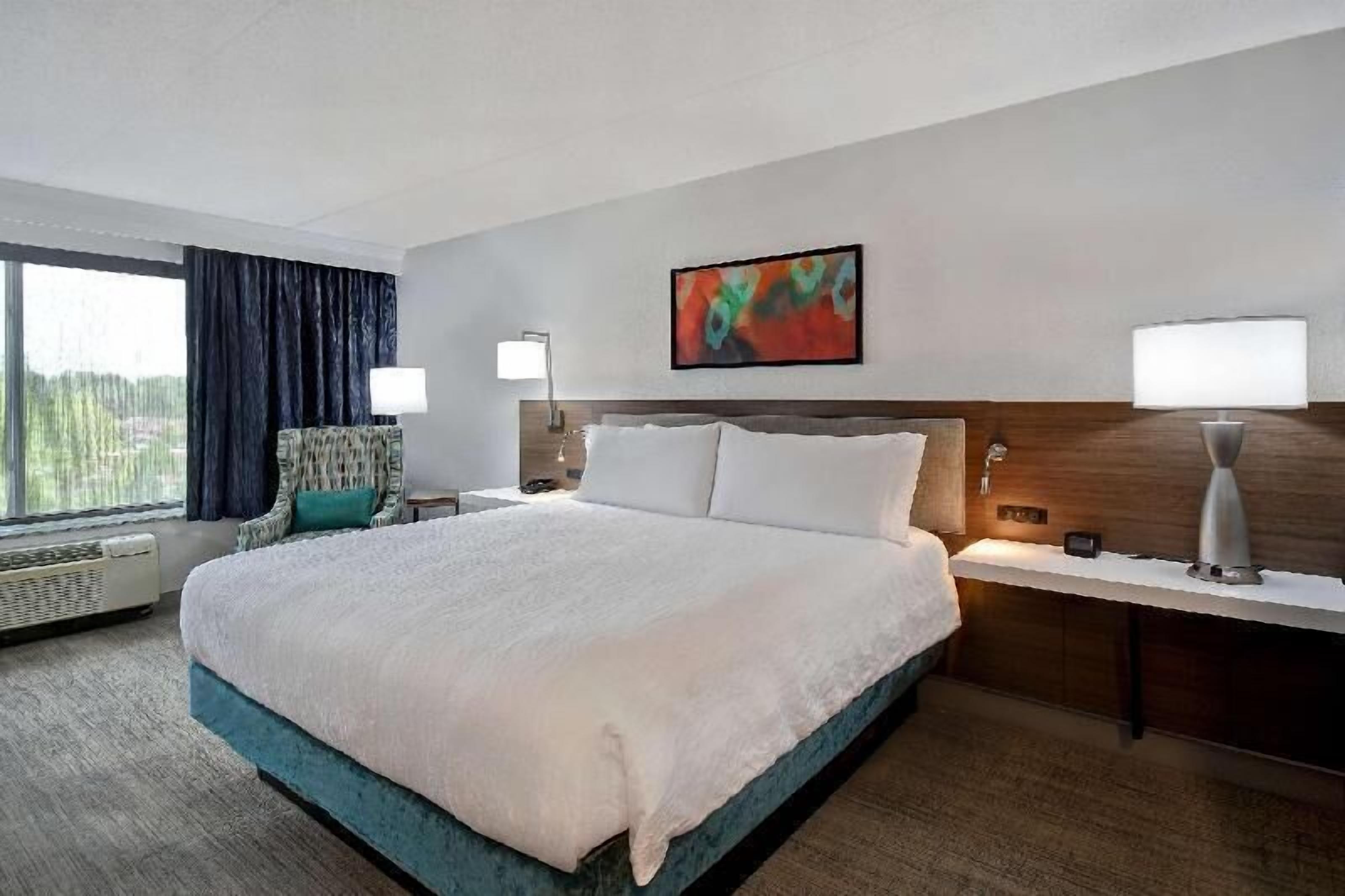 Desk, laptop workspace, blackout drapes, iron/ironing board