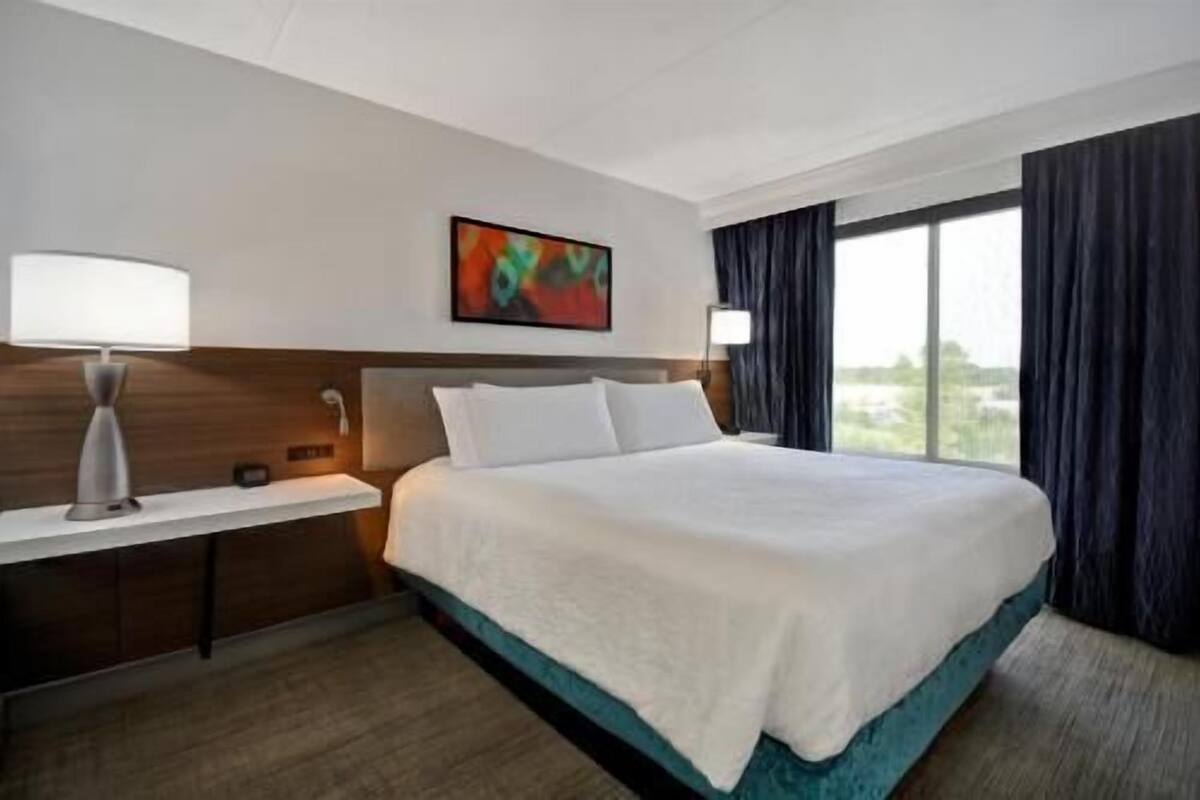 Desk, laptop workspace, blackout drapes, iron/ironing board