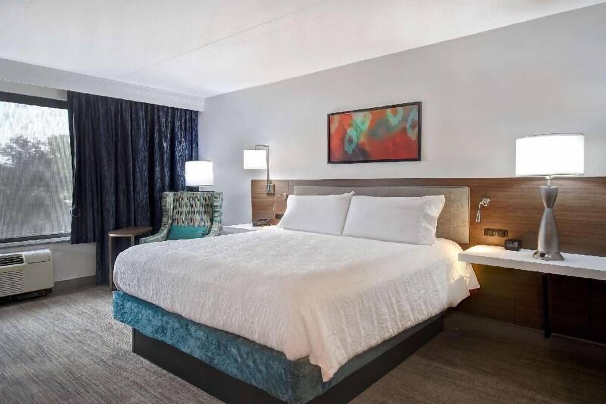 Desk, laptop workspace, blackout drapes, iron/ironing board