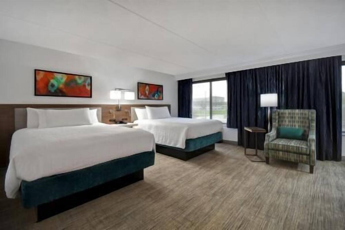 Desk, laptop workspace, blackout drapes, iron/ironing board