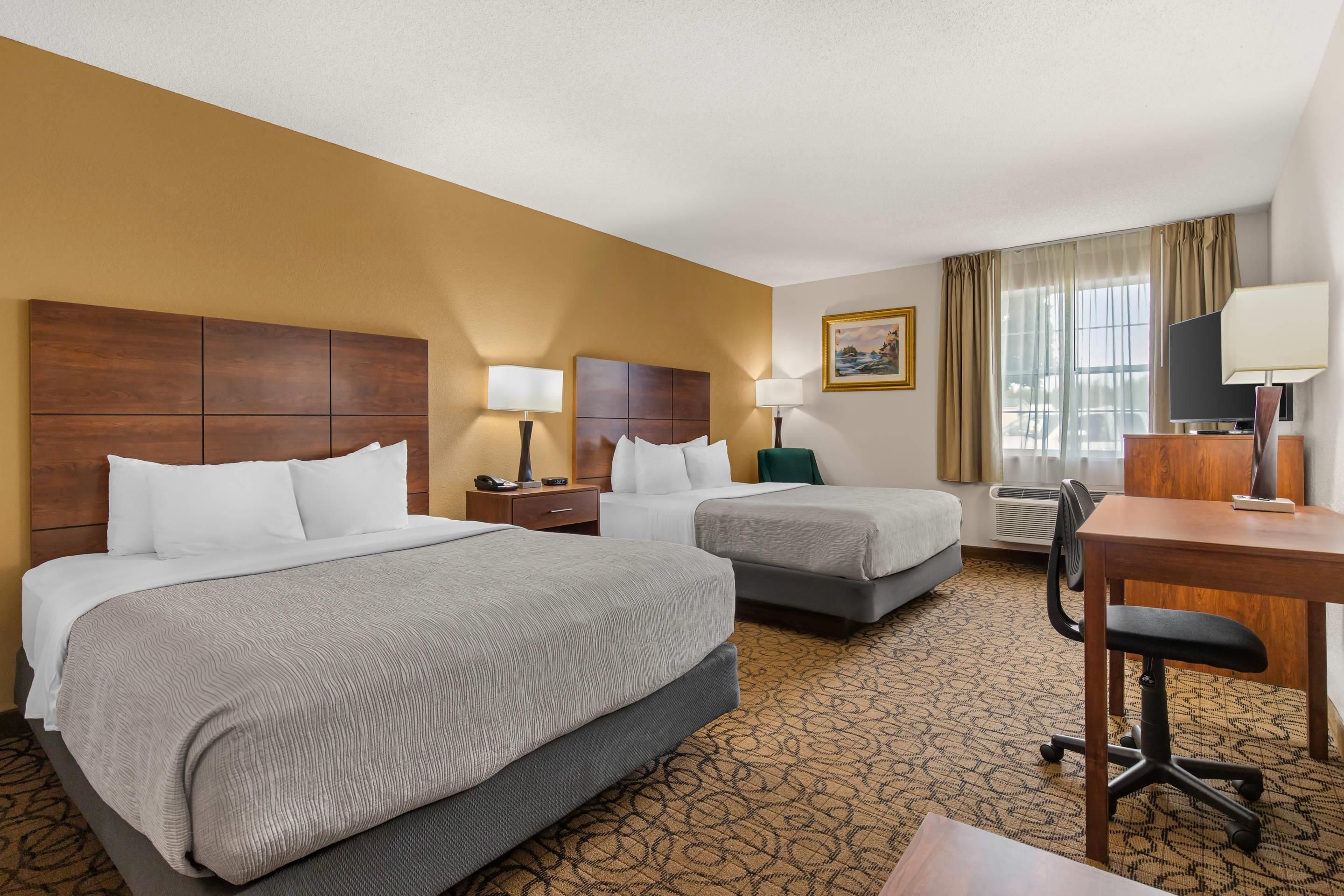 Standard Room, 2 Queen Beds, Non Smoking | Pillowtop beds, desk, laptop workspace, blackout drapes