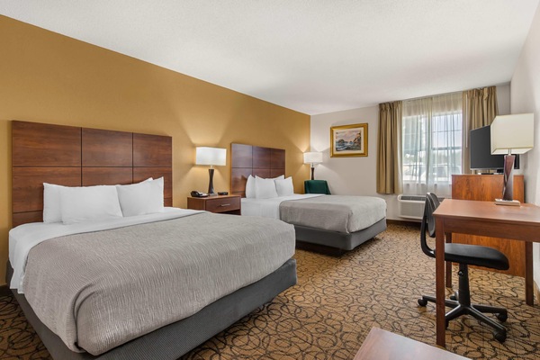 Standard Room, 2 Queen Beds, Non Smoking | Pillowtop beds, desk, laptop workspace, blackout drapes