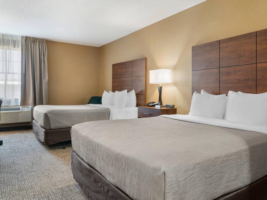 Standard Room, 2 Queen Beds, Non Smoking | Pillowtop beds, desk, laptop workspace, blackout drapes