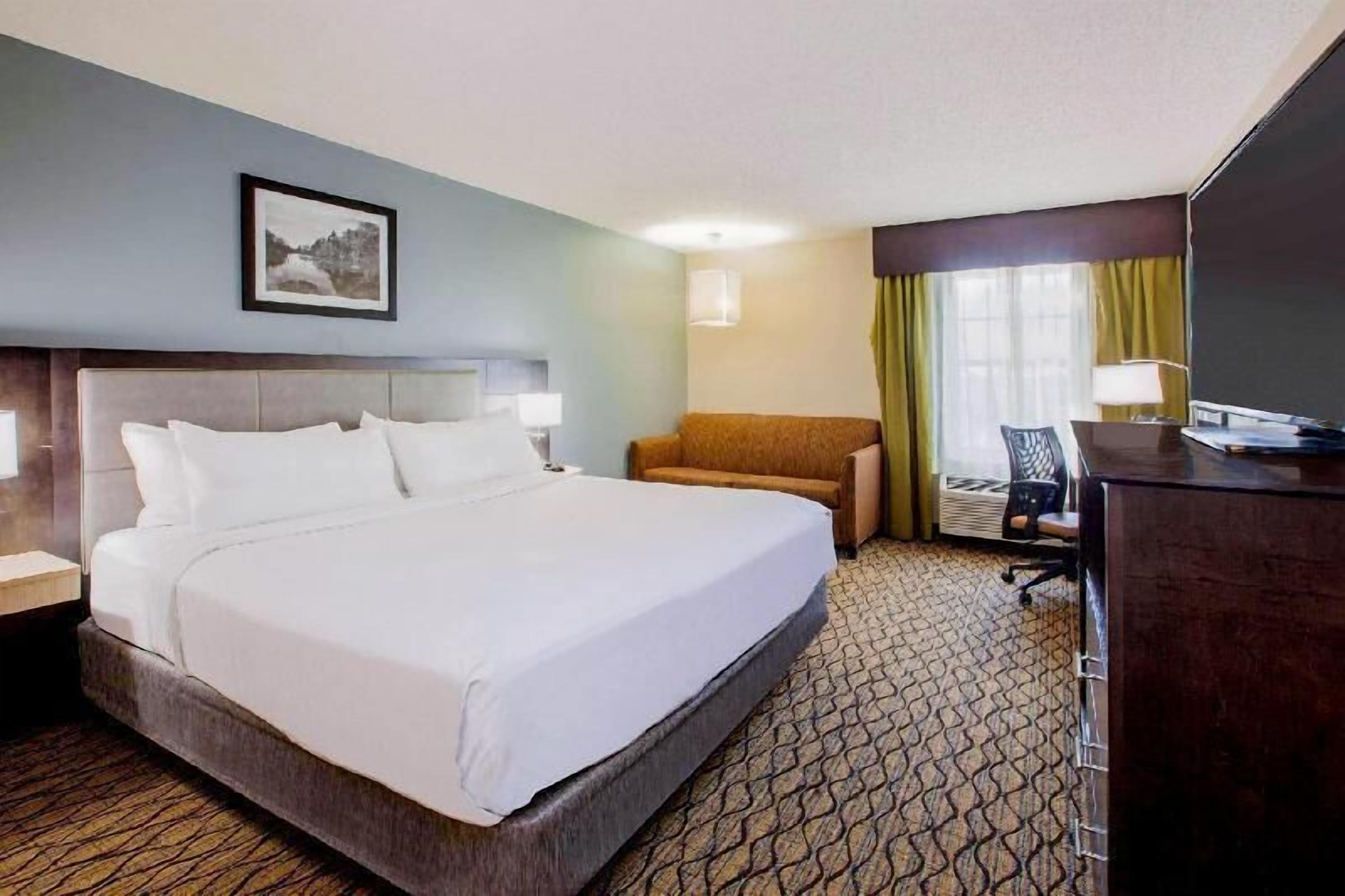 Premium bedding, down comforters, pillowtop beds, in-room safe
