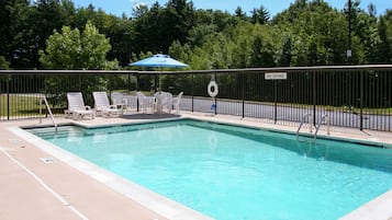 Seasonal outdoor pool, open 9:00 AM to 9:00 PM, pool umbrellas