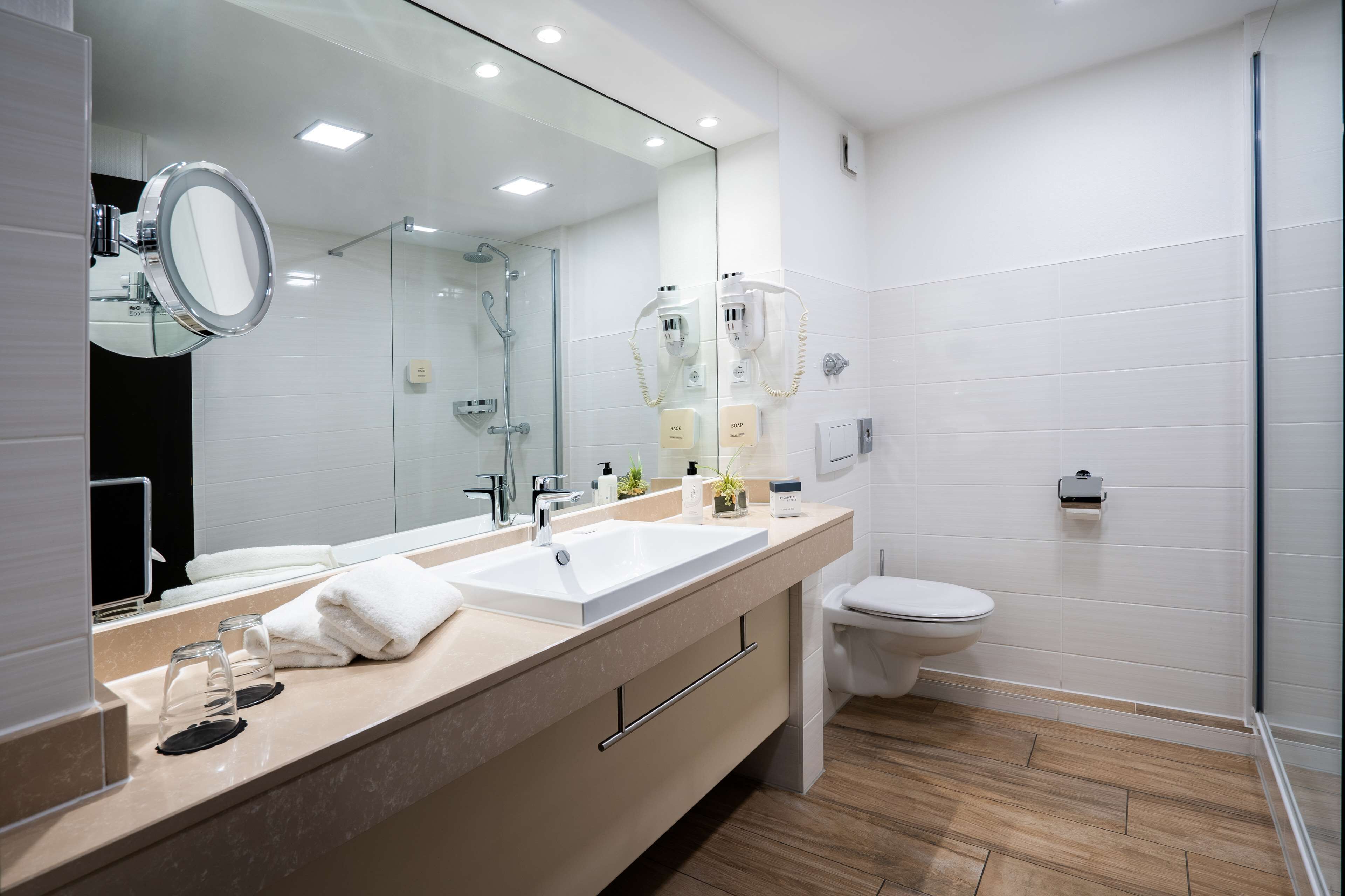 hair dryer, slippers, towels, soap