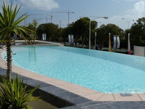 Indoor pool, outdoor pool, pool umbrellas, pool loungers