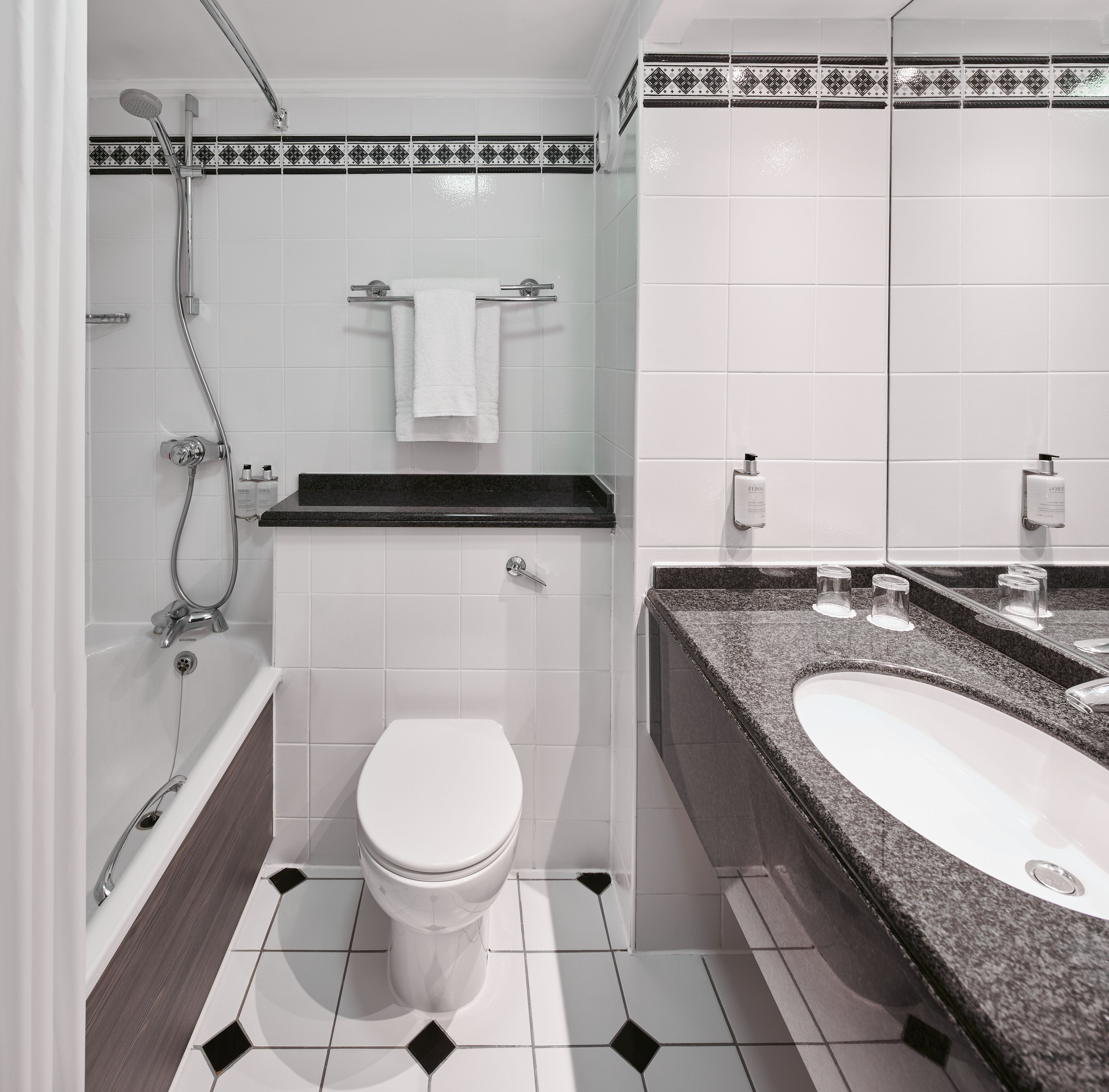 combined shower/bathtub, eco-friendly toiletries, hair dryer, towels