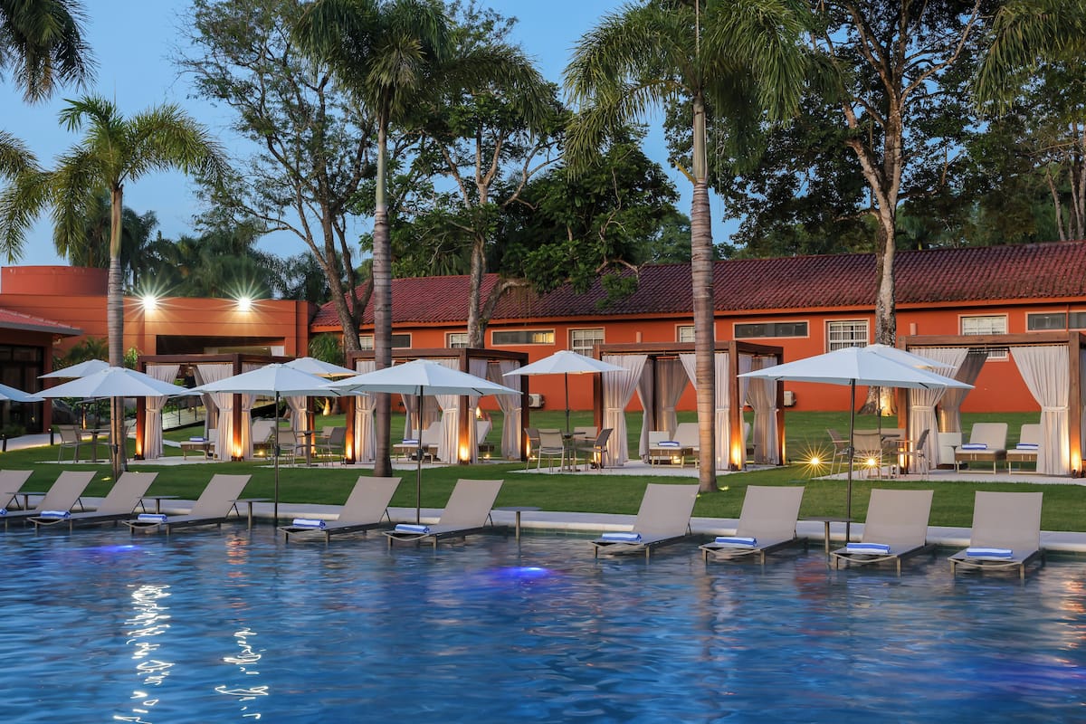 outdoor pool, pool umbrellas, pool loungers