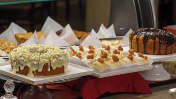 A display of various desserts on trays.