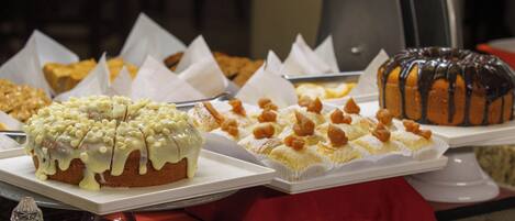A display of various desserts on trays.