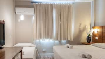 Executivo Triplo Casal | Frigobar, Wi-Fi de cortesia, roupa de cama